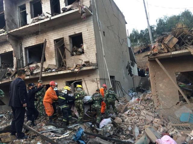 Rescue workers search at site after an explosion hit a town in Fugu county, Shaanxi province, China.(Reuters Photo) Rescue workers search at site after an explosion hit a town in Fugu county, Shaanxi province, China.(Reuters Photo)