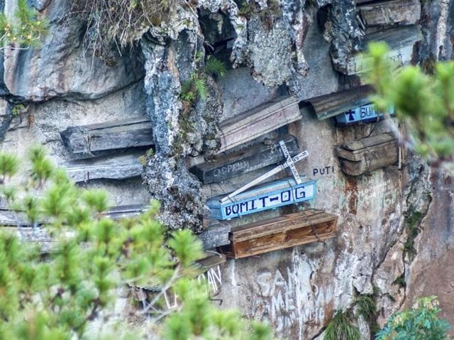 The Hanging Coffins of Sagada, Philippines: In this Pacific archipelago, certain ethnic groups bury their dead in hanging coffins, suspended from hillsides. Intrigued visitors can head to the village of Sagada, where the tradition prevents the dead from being devoured by wild animals. (AFP) The Hanging Coffins of Sagada, Philippines: In this Pacific archipelago, certain ethnic groups bury their dead in hanging coffins, suspended from hillsides. Intrigued visitors can head to the village of Sagada, where the tradition prevents the dead from being devoured by wild animals. (AFP)