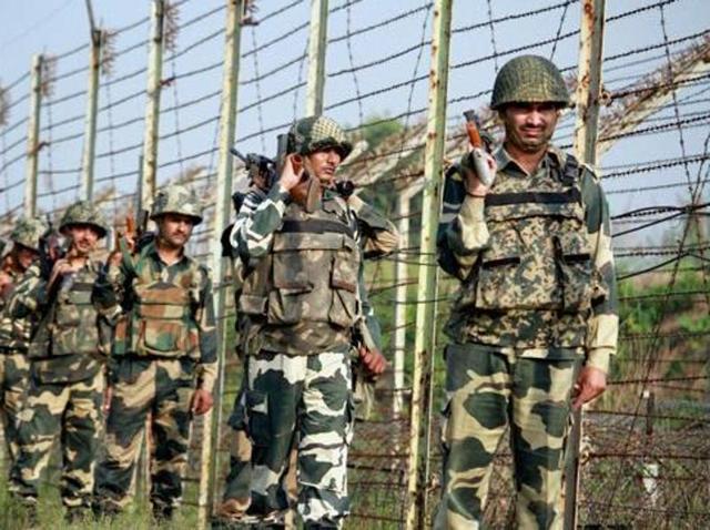 BSF personnel patrol along the fence at International Border in Jammu.(PTI file) BSF personnel patrol along the fence at International Border in Jammu.(PTI file)