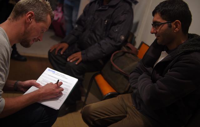 "Jungle" migrants of Calais are interviewed inside an orientation center on October 24, 2016 in Nogent-le-Rotrou, France. Almost 2,000 migrants rode buses out of the Calais "Jungle" on October 24th as French authorities kicked off an operation to dismantle the notorious camp that has become a symbol of Europe's refugee crisis. (AFP Photo) "Jungle" migrants of Calais are interviewed inside an orientation center on October 24, 2016 in Nogent-le-Rotrou, France. Almost 2,000 migrants rode buses out of the Calais "Jungle" on October 24th as French authorities kicked off an operation to dismantle the notorious camp that has become a symbol of Europe's refugee crisis. (AFP Photo)