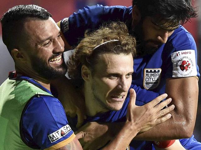 Atletico de Kolkata (red white) and Mumbai City FC players in action during ISL match in Kolkata. (PTI Photo) Atletico de Kolkata (red white) and Mumbai City FC players in action during ISL match in Kolkata. (PTI Photo)
