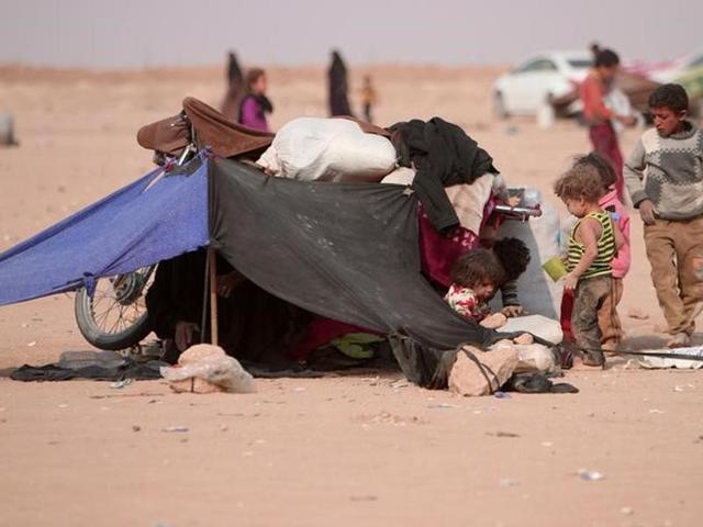 Refugees rest under a makeshift tent near the Iraqi border in Hasaka Governorate. (Reuters) Refugees rest under a makeshift tent near the Iraqi border in Hasaka Governorate. (Reuters)