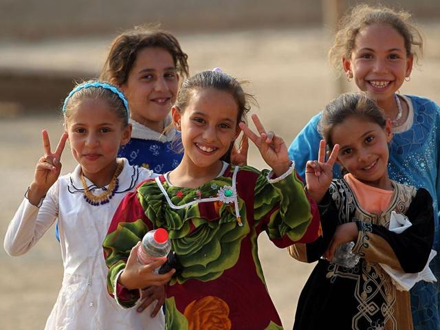 Iraqi children from the village of al-Khuwayn, south of Mosul, pose for a photo after Iraqi government forces recaptured the village from Islamic State (IS) group jihadists, in part of an ongoing operation to tighten the noose around Mosul and reclaim the last major Iraqi city under IS control. (AFP) Iraqi children from the village of al-Khuwayn, south of Mosul, pose for a photo after Iraqi government forces recaptured the village from Islamic State (IS) group jihadists, in part of an ongoing operation to tighten the noose around Mosul and reclaim the last major Iraqi city under IS control. (AFP)