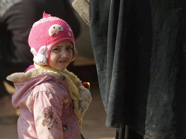 Zainab, 2, an Iraqi refugee that fled violence in Mosul, stands upon arriving in al-Kherbeh village, northern Aleppo province, Syria. (REUTERS) Zainab, 2, an Iraqi refugee that fled violence in Mosul, stands upon arriving in al-Kherbeh village, northern Aleppo province, Syria. (REUTERS)