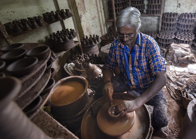 The National Association for the Blind, the NGO that works with the women, buys diyas from Dharavi potter Babu Lala Gohil . (Kunal Patil/HT) The National Association for the Blind, the NGO that works with the women, buys diyas from Dharavi potter Babu Lala Gohil . (Kunal Patil/HT)