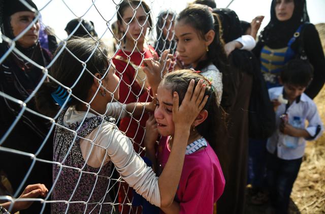 Newly displaced Iraqi's who fled from the city of Mosul, Iraq's last major Islamic State (IS) group stronghold, are reunited with their relatives who came two years ago to the refugee camp in the Khazer area, near near the Kurdish checkpoint of Aksi Kalak, some 40 kilometres east of Arbil following their arrival on October 26, 2016. (AFP) Newly displaced Iraqi's who fled from the city of Mosul, Iraq's last major Islamic State (IS) group stronghold, are reunited with their relatives who came two years ago to the refugee camp in the Khazer area, near near the Kurdish checkpoint of Aksi Kalak, some 40 kilometres east of Arbil following their arrival on October 26, 2016. (AFP)
