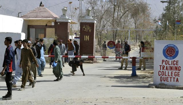 People walk out of the Police Training College in Quetta on Tuesday. (AP) People walk out of the Police Training College in Quetta on Tuesday. (AP)