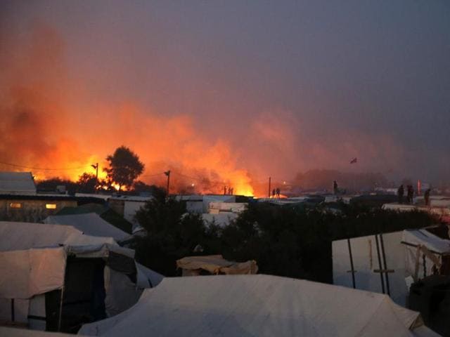 Partial view of the Calais ‘Jungle’ camp taken late on Wednesday during the demolition of the camp, in Calais, northern France, as hundreds of migrants boarded buses on the second day of a massive operation to clear the squalid settlement. (AFP) Partial view of the Calais ‘Jungle’ camp taken late on Wednesday during the demolition of the camp, in Calais, northern France, as hundreds of migrants boarded buses on the second day of a massive operation to clear the squalid settlement. (AFP)