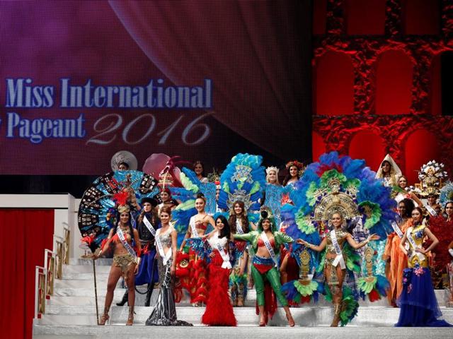 Contestants wearing national costumes pose during the opening of the pageant. (REUTERS) Contestants wearing national costumes pose during the opening of the pageant. (REUTERS)