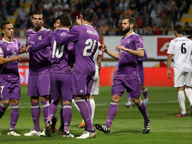 Real Madrid players celebrate their opening goal. (AFP) Real Madrid players celebrate their opening goal. (AFP)