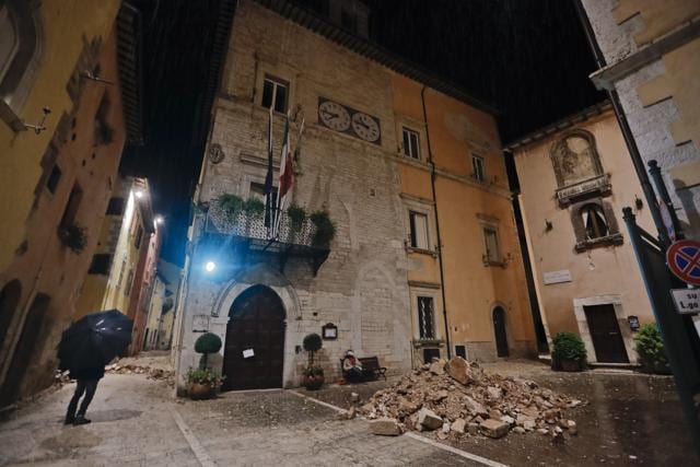 People wander around the small town of Visso in central Italy. (AP Photo) People wander around the small town of Visso in central Italy. (AP Photo)