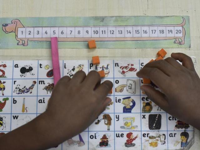 A student tries his hand on a board game. (Vipin Kumar/HT PHOTO)
