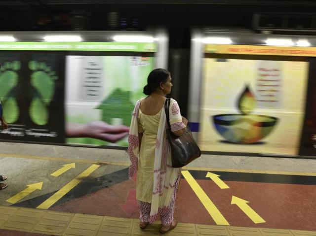 A woman waits at a station, in New Delhi. (Sanjeev Verma/HT Photo)