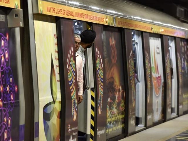 People look out as the metro doors close, in New Delhi. (Sanjeev Verma/HT Photo)