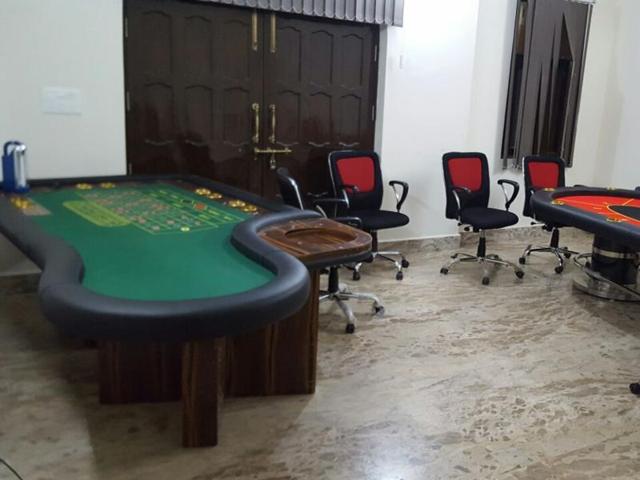 The police raided the farmhouse in Park Lane and found three large casino tables, stake money R43,500, seven packets of playing cards, 2,968 gambling tokens worth crores and 85 bottles of liquor from the spot. The police raided the farmhouse in Park Lane and found three large casino tables, stake money R43,500, seven packets of playing cards, 2,968 gambling tokens worth crores and 85 bottles of liquor from the spot.