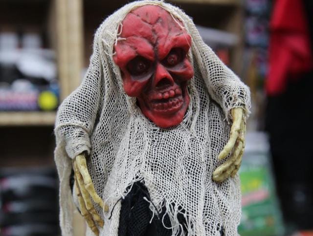 With glowing red eyes, the scary electronic statue is for Rs 475.  (Prabhas Roy/HT Photo) 