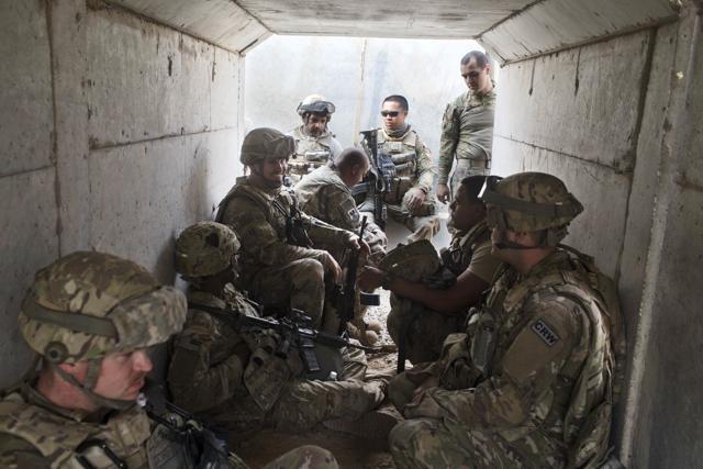 US military personnel sit in a bunker as an incoming mortar alarm is called at a coalition air base in Qayara, some 50 kilometers south of Mosul, Iraq. (AP) US military personnel sit in a bunker as an incoming mortar alarm is called at a coalition air base in Qayara, some 50 kilometers south of Mosul, Iraq. (AP)