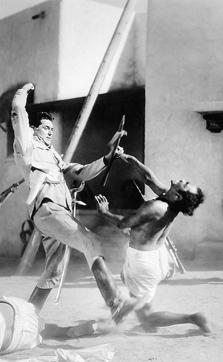 The bad old days: A still from Gunga Din (1939) based on Rudyard Kipling's ballad. Here, Cary Grant teaches a native to behave! (Bettmann Archive) The bad old days: A still from Gunga Din (1939) based on Rudyard Kipling's ballad. Here, Cary Grant teaches a native to behave! (Bettmann Archive)