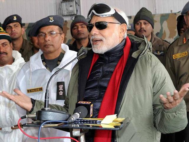 File photo of Prime Minister Narendra Modi sharing sweets with the officers and jawans of Indian Armed Forces during his visit to Siachen on the occasion of Diwali in 2014. (PTI photo) File photo of Prime Minister Narendra Modi sharing sweets with the officers and jawans of Indian Armed Forces during his visit to Siachen on the occasion of Diwali in 2014. (PTI photo)