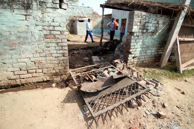 A damaged gate of a house after firing from the Pakistani side of border in Abdullian village in RS Pura. (Nitin Kanotra /HT Photo)