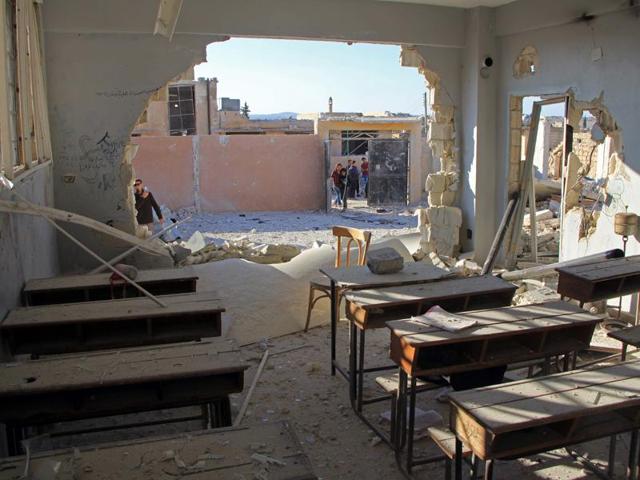 A general view shows a damaged classroom at a school after it was hit in an air strike in the village of Hass, in the south of Syria's rebel-held Idlib province.(Omar haj Kadour/AFP)