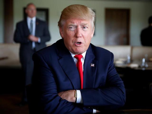 Republican US presidential nominee Donald Trump sits for an interview at Trump National Doral golf club in Miami, Florida. (REUTERS)