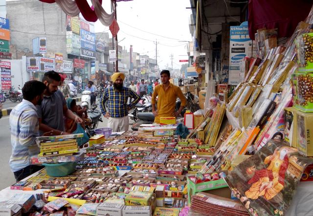 People purchasing firecrackers in Moga on Friday. (HT Photo)