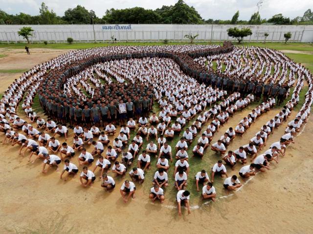 Inmates form the Thai symbol for the number nine, in honour of late Thai King Bhumibol Adulyadej, also known as King Rama IX, at the Central Correctional Institution for Young Offenders in Pathum Thani province, on the outskirts of Bangkok. (Reuters Photo)