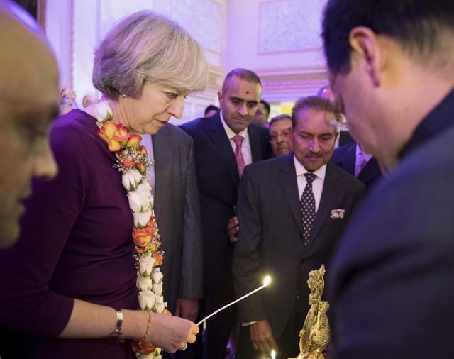 British Prime Minister Theresa May at a Diwali reception in her official residence 10 Downing Street in London last week. (PTI) British Prime Minister Theresa May at a Diwali reception in her official residence 10 Downing Street in London last week. (PTI)