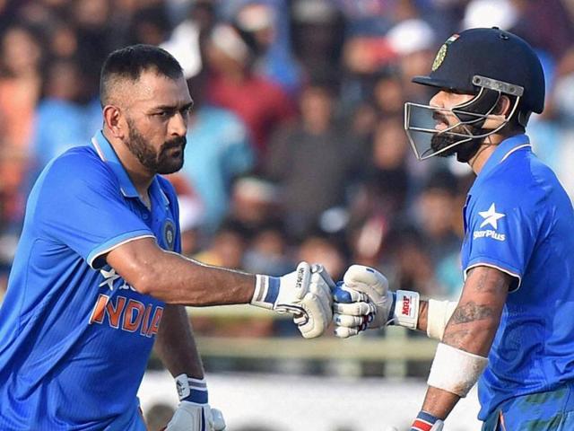 Indian captain MS Dhoni congratulates Virat Kohli on his half century. (PTI photo) Indian captain MS Dhoni congratulates Virat Kohli on his half century. (PTI photo)