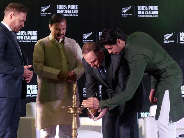 New Zealand Prime Minister John Key lights a traditional lamp as Culture and Tourism Minister Mahesh Sharma, Bollywood actor and Tourism New Zealand's brand ambassador, Sidharth Malhotra and former New Zealand Cricket Captain Brendon McCullum look on at an India- New Zealand Tourism Promotion Event in New Delhi. (PTI Photo)