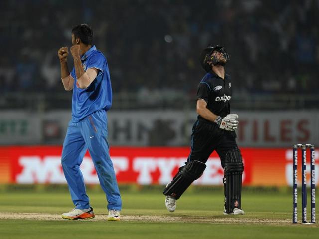 New Zealand's captain Kane Williamson, right, reacts after India's Axar Patel, left, dismissed him. (AP photo) New Zealand's captain Kane Williamson, right, reacts after India's Axar Patel, left, dismissed him. (AP photo)