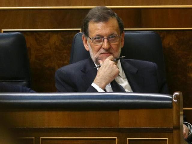 Spain's acting Prime Minister Mariano Rajoy after a debate at Parliament in Madrid on Thursday. Rajoy is likely to be confirmed as prime minister in a parliamentary confidence vote on Saturday.(Reuters) Spain's acting Prime Minister Mariano Rajoy after a debate at Parliament in Madrid on Thursday. Rajoy is likely to be confirmed as prime minister in a parliamentary confidence vote on Saturday.(Reuters)
