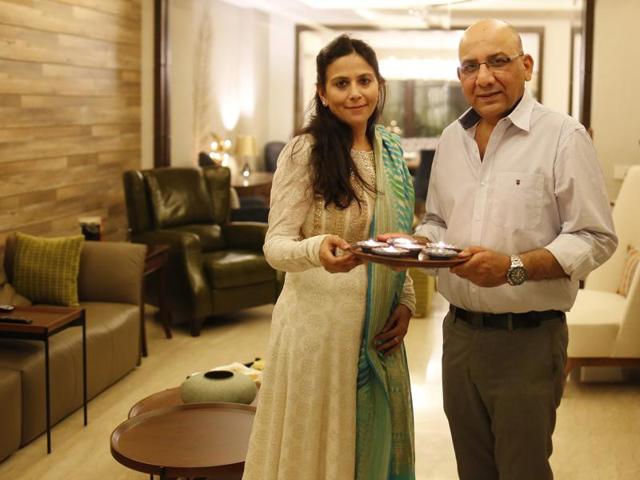 Entrepreneur Pawan Abbott and his wife Tanu celebrating Diwali at their new house in South Delhi.(Ravi Choudhary/HT PHOTO) Entrepreneur Pawan Abbott and his wife Tanu celebrating Diwali at their new house in South Delhi.(Ravi Choudhary/HT PHOTO)