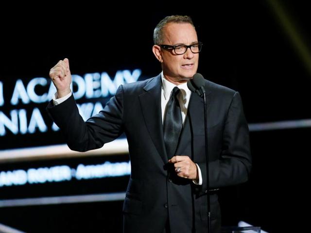 Actor Tom Hanks presents actress Felicity Jones the British Artist of the year award at the British Academy of Film and Television Arts (BAFTA) Los Angeles' Britannia Awards in Beverly Hills. (REUTERS) Actor Tom Hanks presents actress Felicity Jones the British Artist of the year award at the British Academy of Film and Television Arts (BAFTA) Los Angeles' Britannia Awards in Beverly Hills. (REUTERS)