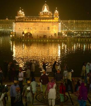 An illuminated Golden Temple on the eve of Diwali, in Amritsar on Saturday. (Sameer Sehgal/HT Photo)