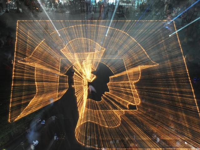 Earthen lamps lit to form a light mural in honour of martyrs, in Chandigarh on Saturday. (Anil Dayal/HT Photo)