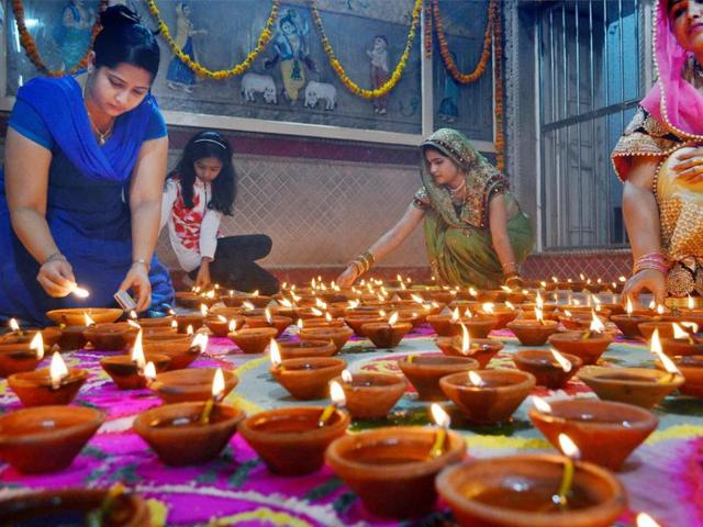 Devotees light lamps to celebrate Diwali at Keshev Dev temple in Mathura on Saturday. (PTI) Devotees light lamps to celebrate Diwali at Keshev Dev temple in Mathura on Saturday. (PTI)