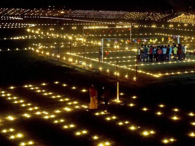 Sportspersons light candles to pay tribute to Indian soldiers on the eve of Diwali at a stadium in Varanasi on Saturday. (PTI) Sportspersons light candles to pay tribute to Indian soldiers on the eve of Diwali at a stadium in Varanasi on Saturday. (PTI)