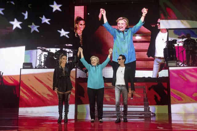 Democratic presidential candidate, Hillary Clinton stands with performer Jennifer Lopez and singer-songwriter Marc Anthony. (AP Photo) Democratic presidential candidate, Hillary Clinton stands with performer Jennifer Lopez and singer-songwriter Marc Anthony. (AP Photo)