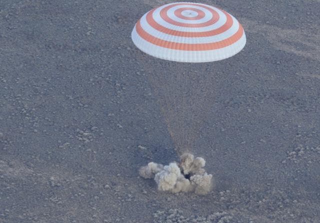 A Russian Soyuz MS space capsule carrying 3 astronauts lands in Kazakhstan.  (AP Photo)