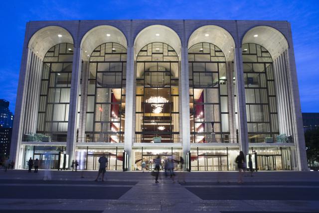 Pedestrians make their way in front of the Metropolitan Opera house at New York's Lincoln Centre. (AP File Photo) Pedestrians make their way in front of the Metropolitan Opera house at New York's Lincoln Centre. (AP File Photo)