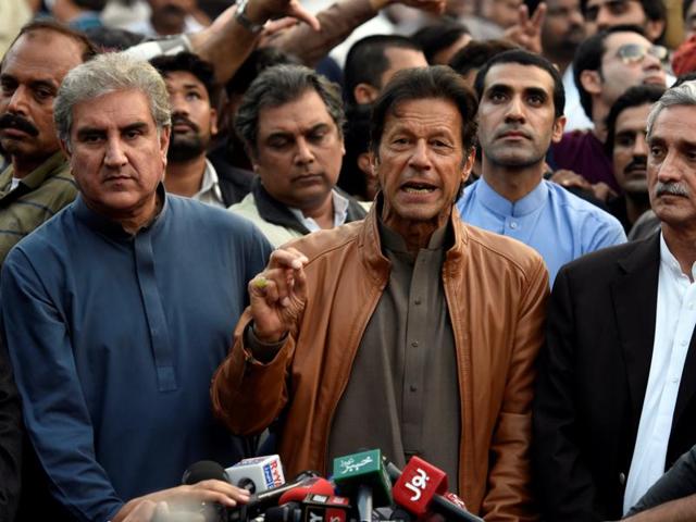 Pakistani opposition leader Imran Khan (C) talks to media outside his house in Islamabad.(REUTERS) Pakistani opposition leader Imran Khan (C) talks to media outside his house in Islamabad.(REUTERS)