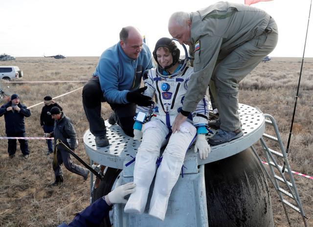 Russian space agency rescue team helps International Space Station (ISS) crew member Kate Rubins.  (Reuters Photo)