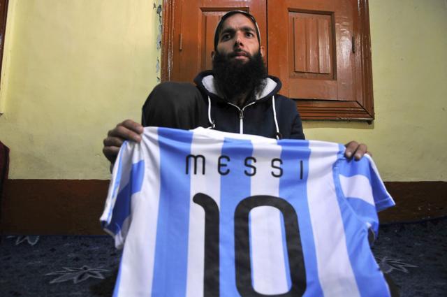 Mohammad Mansoor Shafi shows the Messi T-shirt he had bought for his brother Nasir, at their house in Harwan on the outskirts of Srinagar. (Waseem Andrabi/HT Photo) Mohammad Mansoor Shafi shows the Messi T-shirt he had bought for his brother Nasir, at their house in Harwan on the outskirts of Srinagar. (Waseem Andrabi/HT Photo)