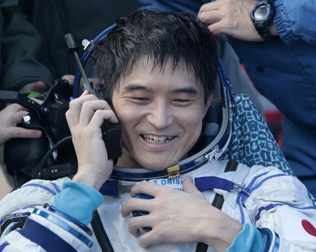 Japanese astronaut Takuya Onishi calls his relatives.  (AP Photo)