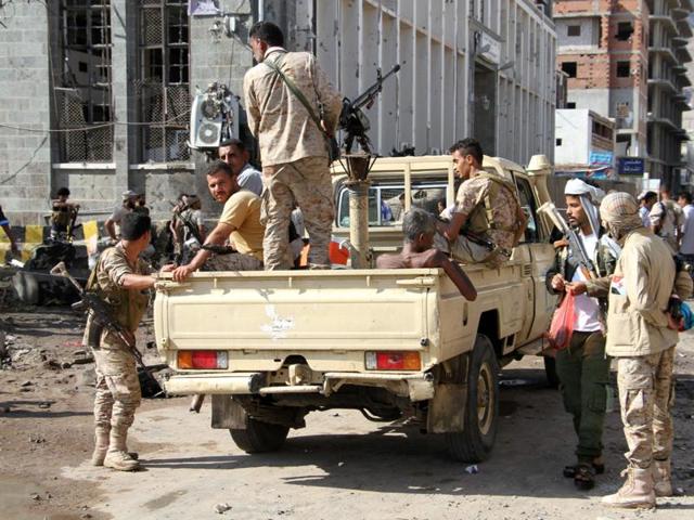 Yemenis, including security forces, gather at the site where a suicide car bomb exploded next to the central bank in Yemen's second city Aden on October 29, 2016. At least 17 civilians were killed in Yemeni city of Taiz by a coalition air strike that struck a house, also on Saturday.(AFP) Yemenis, including security forces, gather at the site where a suicide car bomb exploded next to the central bank in Yemen's second city Aden on October 29, 2016. At least 17 civilians were killed in Yemeni city of Taiz by a coalition air strike that struck a house, also on Saturday.(AFP)