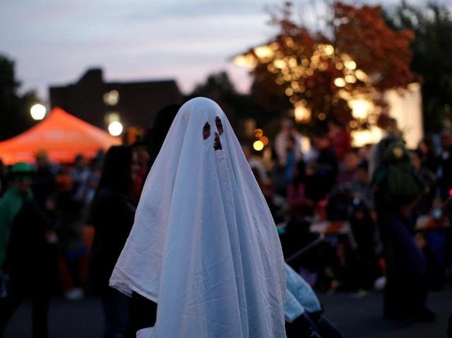 A man in a ghost costume marches in the annual Nyack Halloween Parade in the village of Nyack, New York, US, October 29, 2016. (REUTERS) A man in a ghost costume marches in the annual Nyack Halloween Parade in the village of Nyack, New York, US, October 29, 2016. (REUTERS)