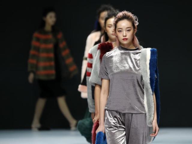 Models parade creations from K Fashion Project designed by Molliolli during the Mercedes-Benz China Fashion Week in Beijing on Wednesday. (AP)