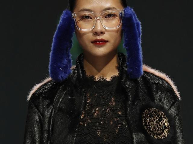 A model presents a creation from K Fashion Project designed by Molliolli during the Mercedes-Benz China Fashion Week in Beijing on Wednesday. (AP)